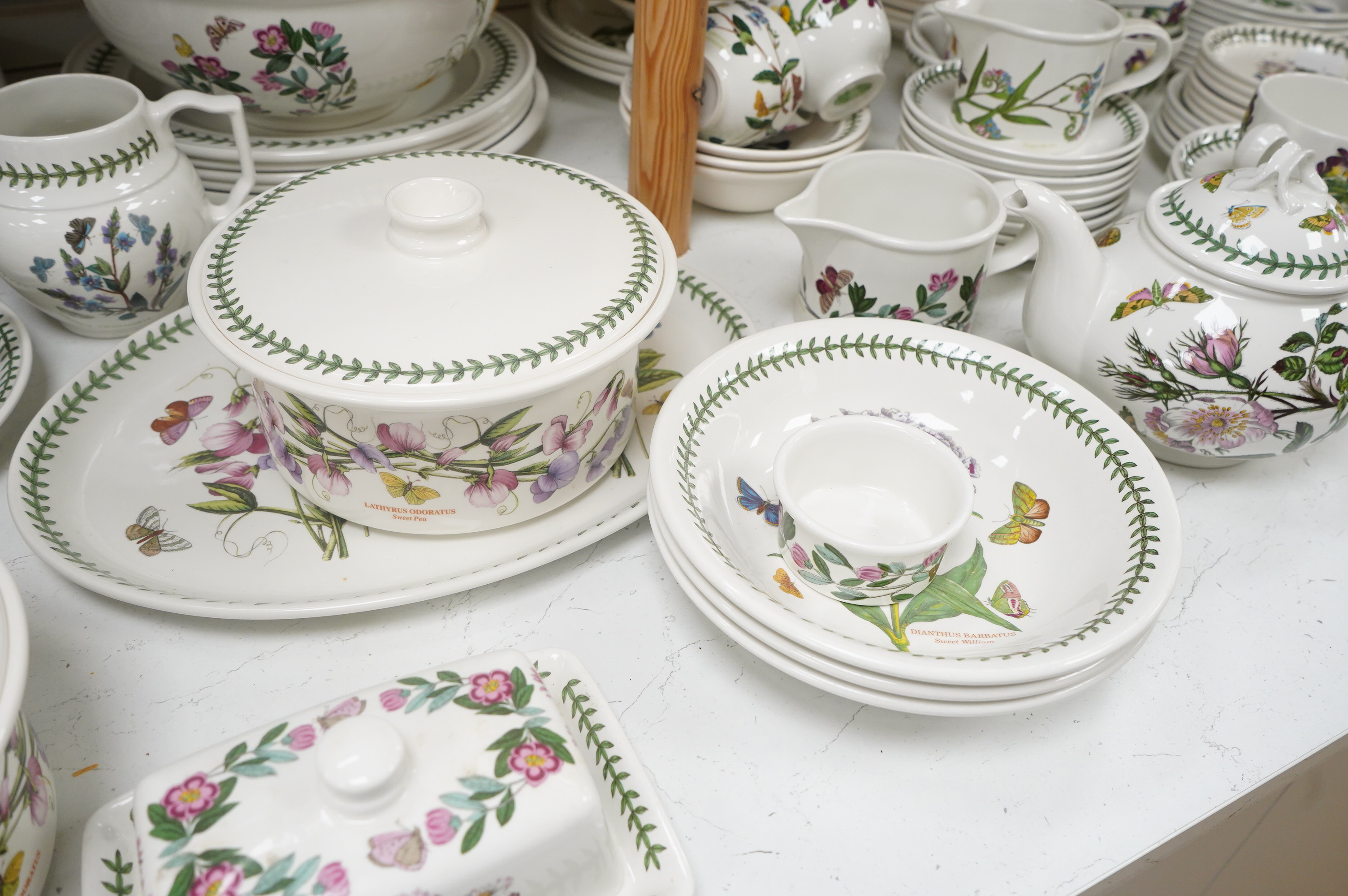 A large quantity of Portmerion Botanic Garden dinner and tea wares to include graduated bowls, dinner plates and side plates